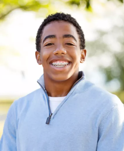 boy smiling with braces